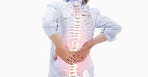 Medical illustration of a patient's spine showing lumbar spondylosis and joint degeneration, conditions expertly treated at Neuron Plus Hospital.