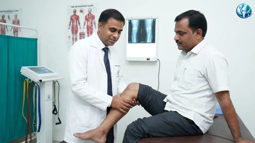 Orthopedic doctor examining a patient's knee joint and range of motion during a consultation at a clinic in Ahilyanagar